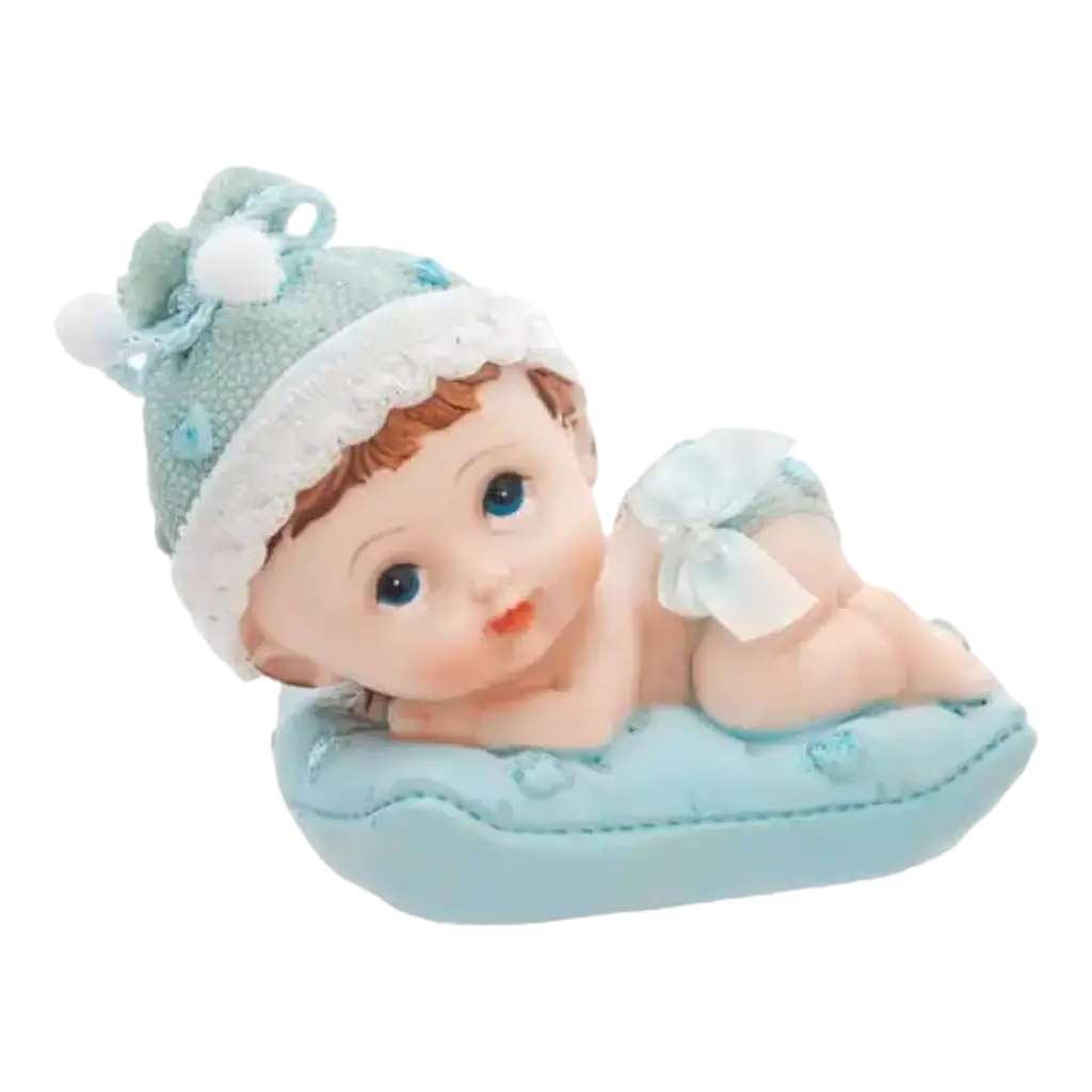 Figurita de bebé sobre cojín azul