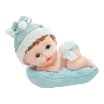 Figurita de bebé sobre cojín azul